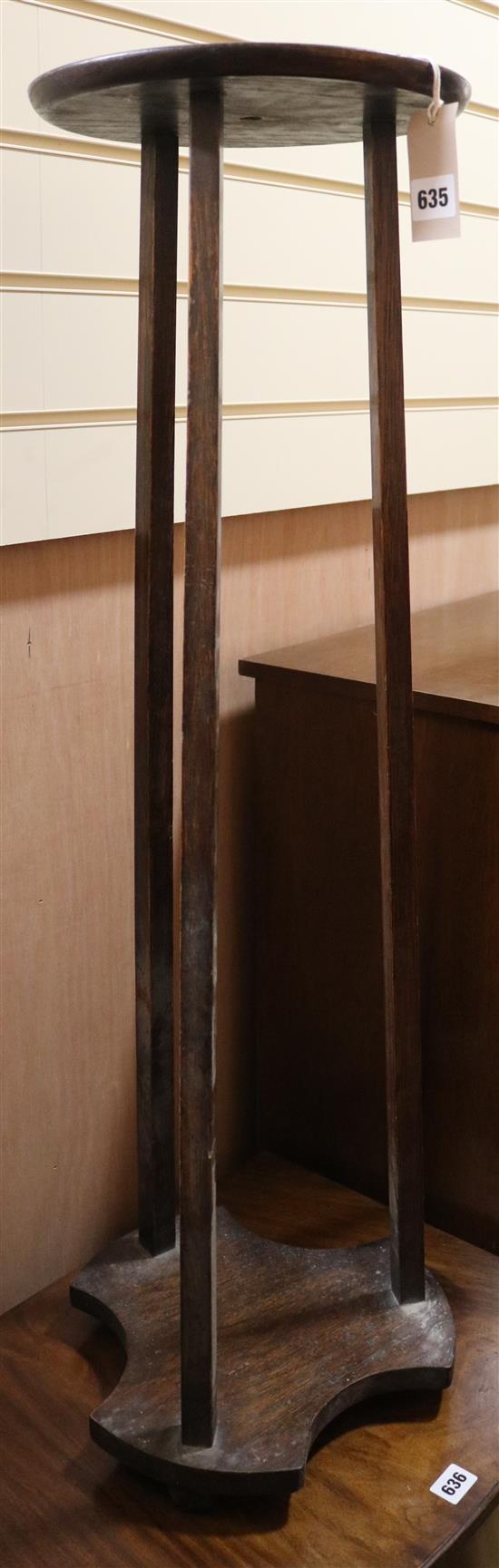 A 1920s oak pedestal